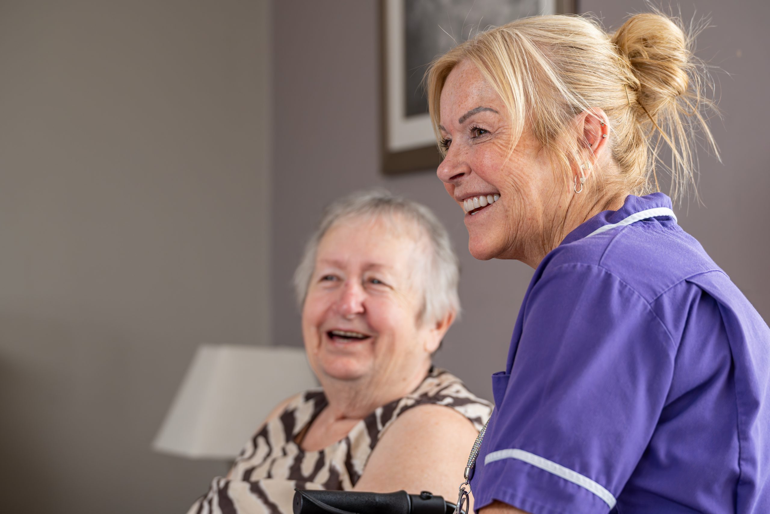 Customer and carer smiling candidly.