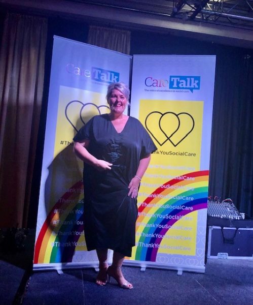 Kerry Parker receives her award on stage